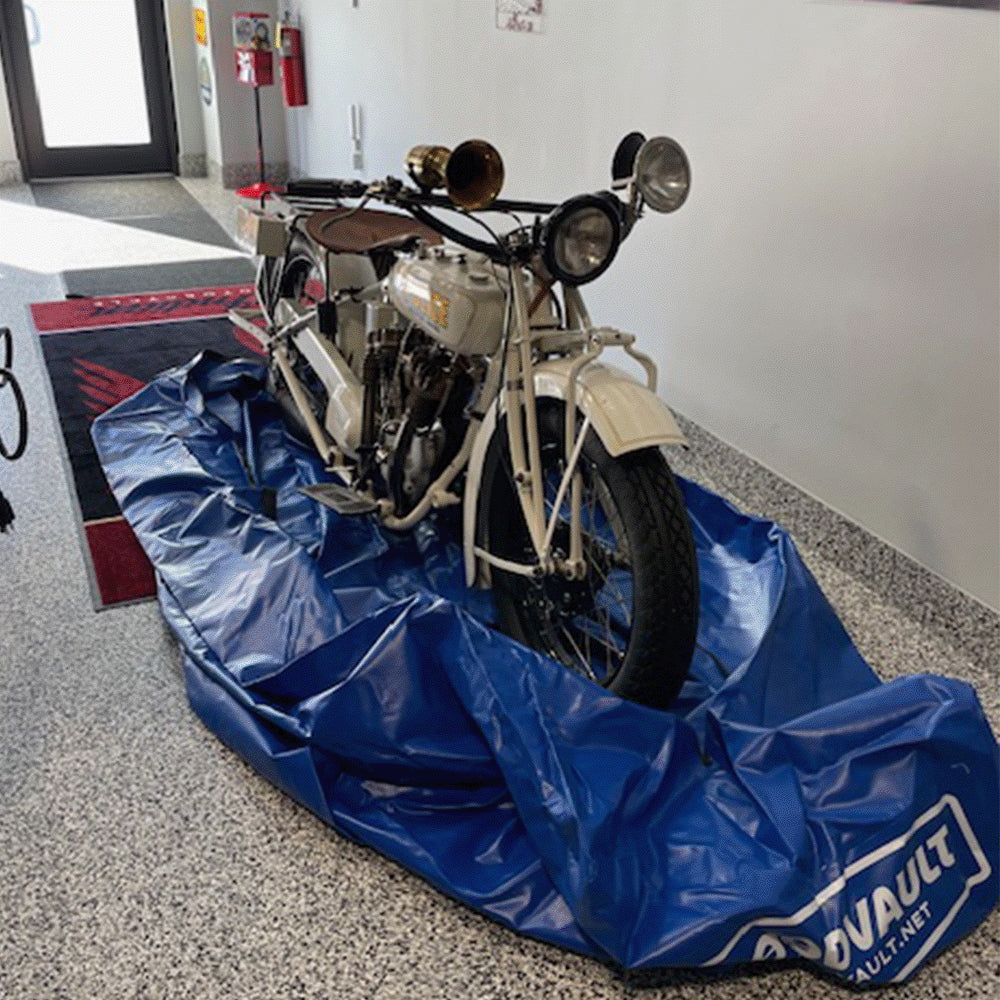Motorcycle rolled onto the FloodVault Moto base.