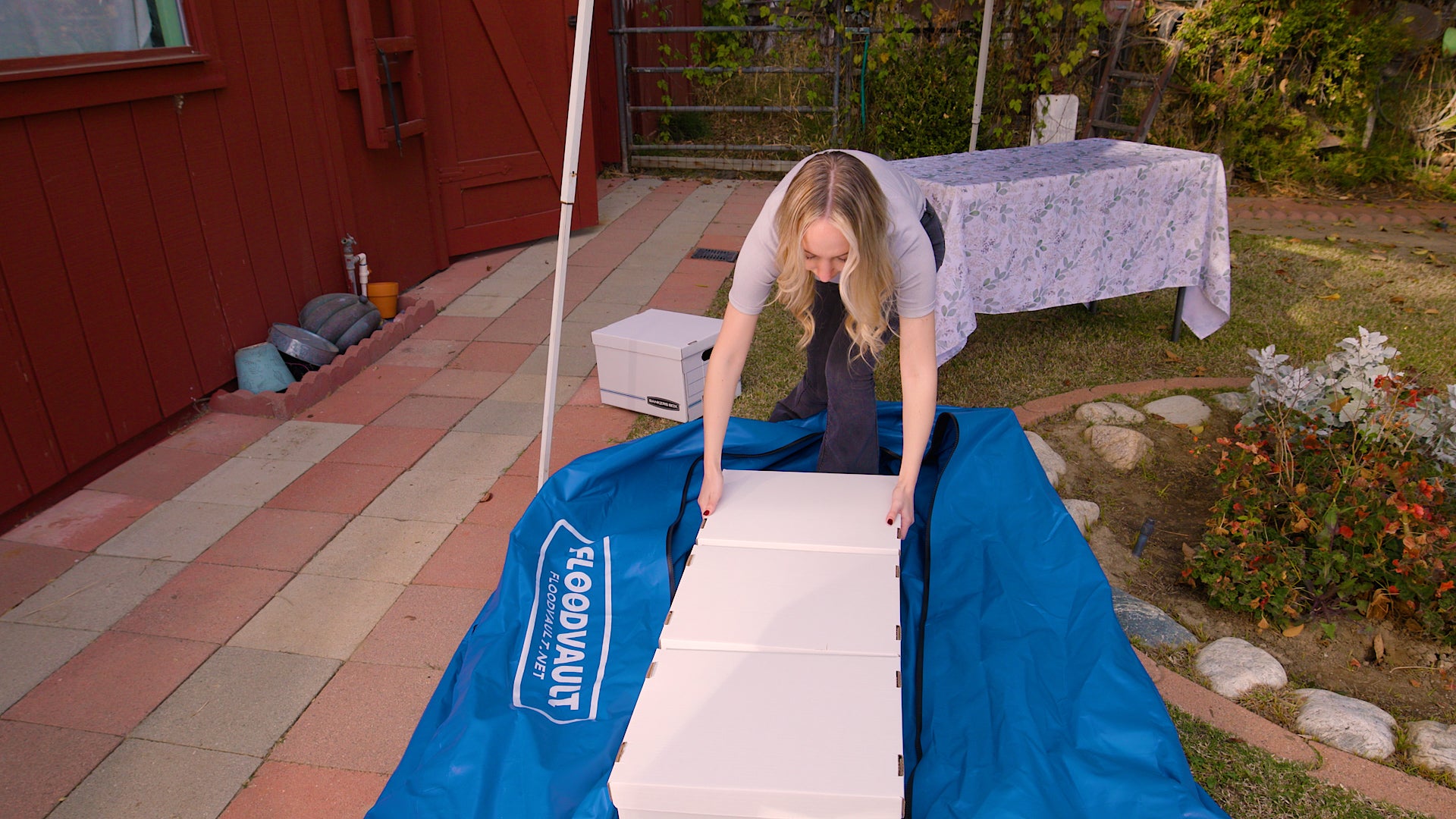 Folding the top of the FloodVault Valuables over the load.