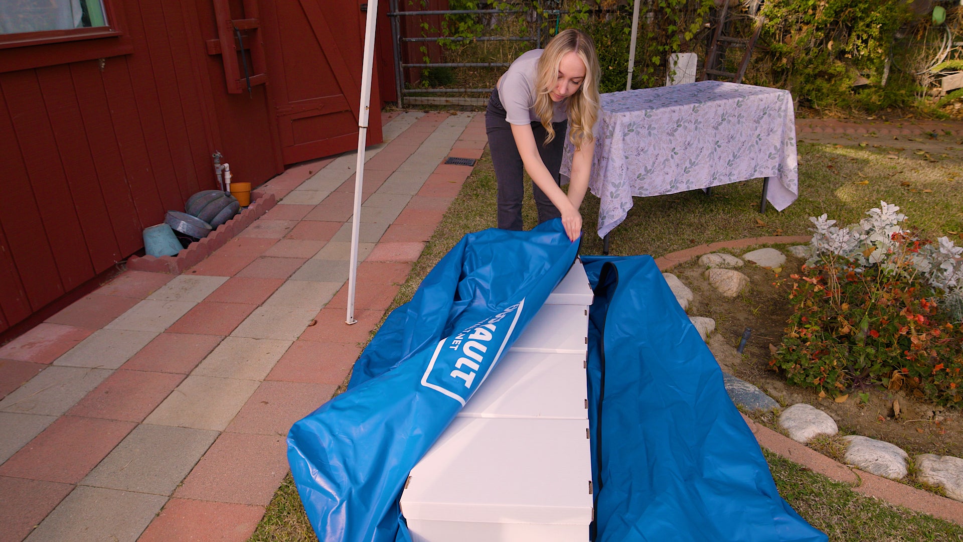Closing the TIZIP zipper across the top of the vault.